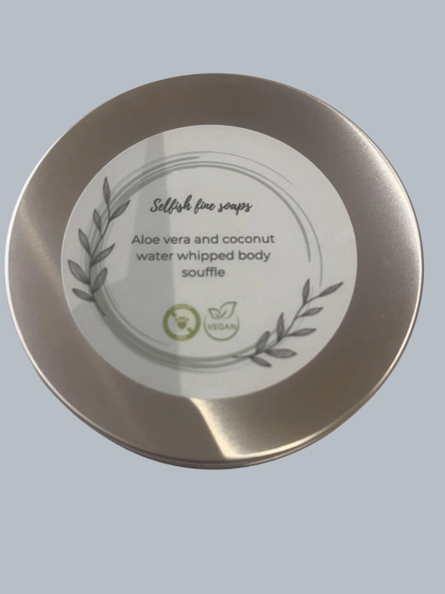 Aloe vera and coconut water whipped body souffle - Selfish Fine Soaps. This is a picture of a tin of handmade whipped body souffle. Made from a blend of shea butter, olive oil and coconut oil. It is highly nourishing for your skin.