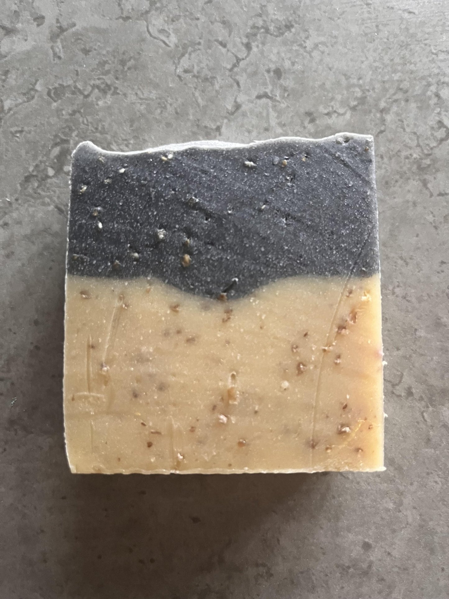 Driftwood and seaweed cold processed soap - Selfish Fine Soaps. This is a handmade cold processed soap. It is yellow on the bottom and grey on the top. It has oatmeal within it to provide exfoliation and a creamy lather. The fragrance is beautiful.