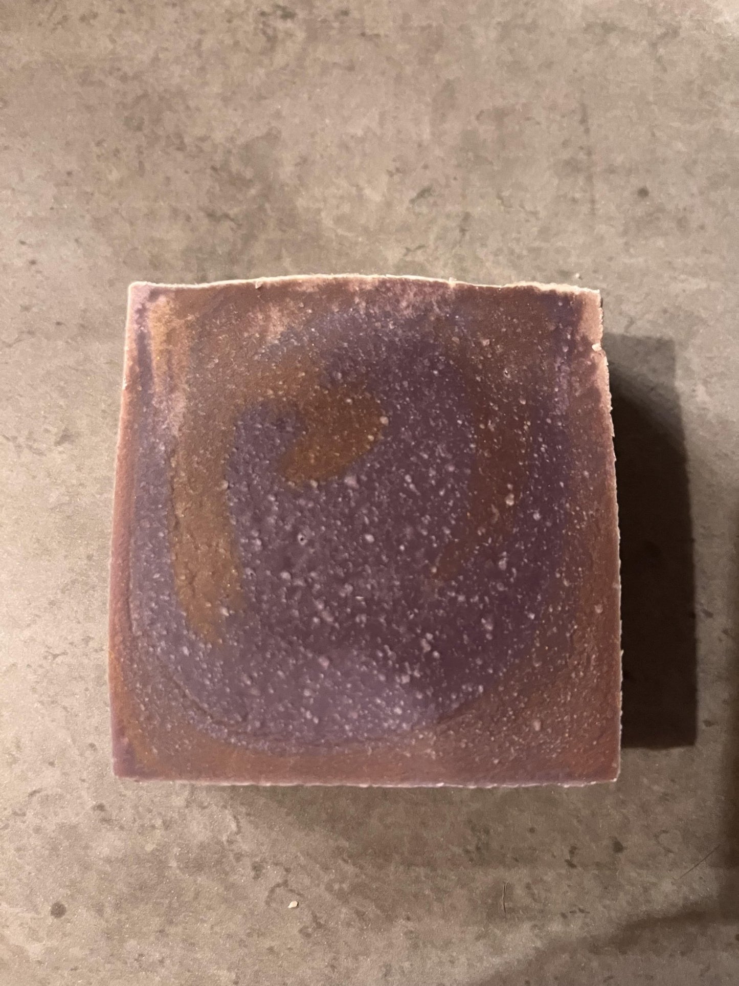 Oud for greatness cold processed soap - Selfish Fine Soaps. This is a bar of handmade cold processed soap which is purple and gold swirl in colour. It is fragranced with Oud for greatness which is a masculine fragrance.