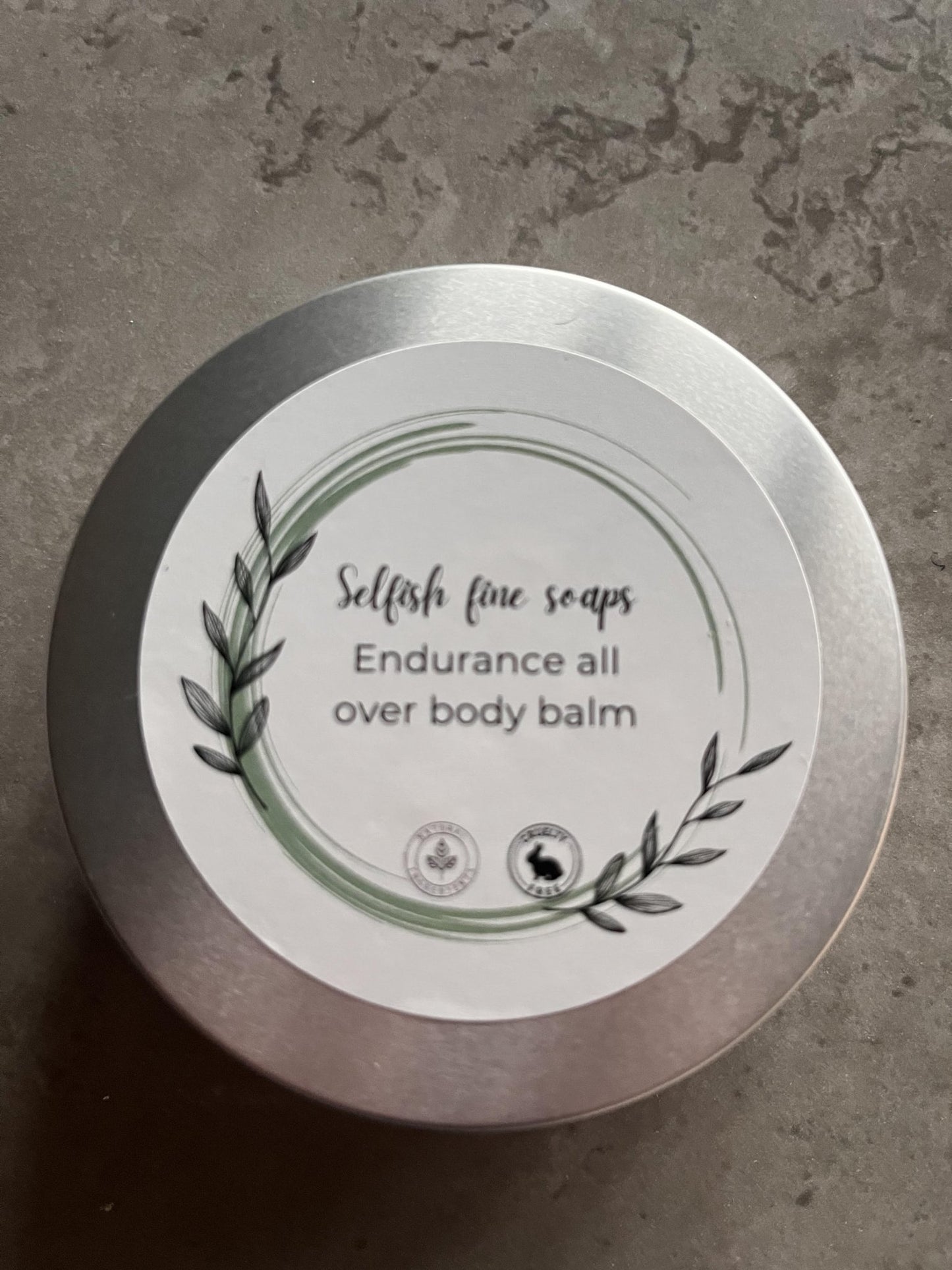 Endurance all over body balm - Selfish Fine Soaps. This is a round tin of balm which an be used by anyone who experiences sore or irritated skin through chafing. It works well for endurance athletes as well as normal people. It protects the skin prior to chaffing and can be used after to calm irritation.